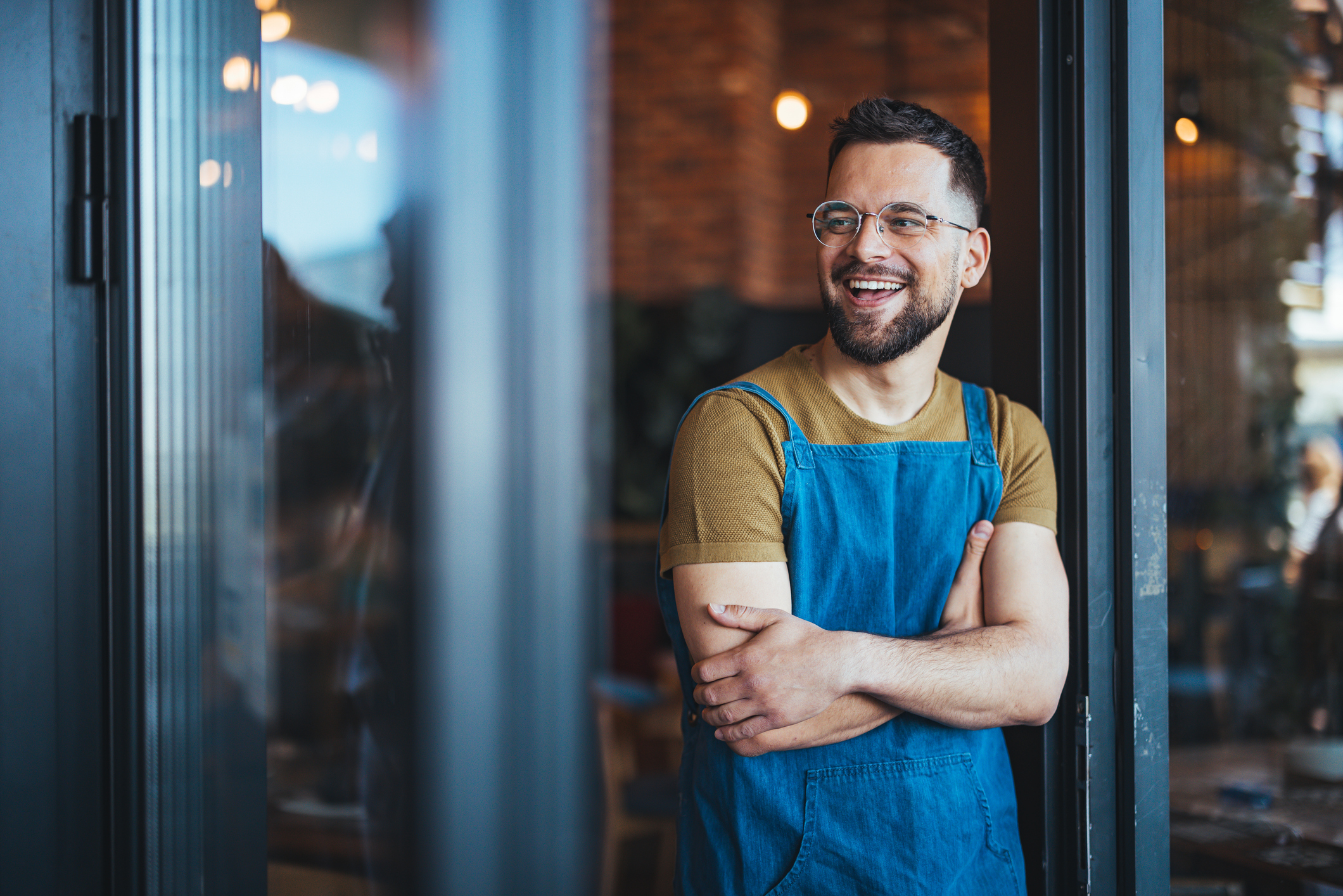 Bartender in a Welcoming Pose at Coffee Shop small business